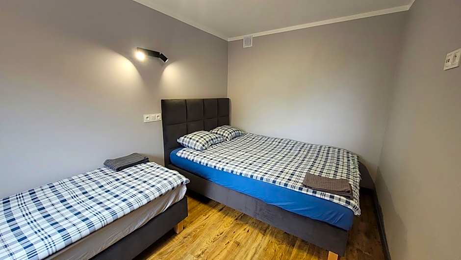 Wrzosowe Wzgórze 5 - Studia i Apartamenty