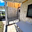 Casa Antia, nuovo bilocale con giardino in Residence con piscina