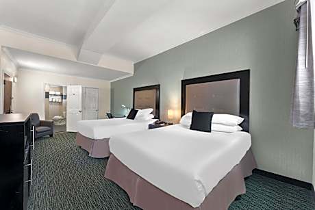 Efficiency Quadruple Room with Two Queen Beds - Non Smoking