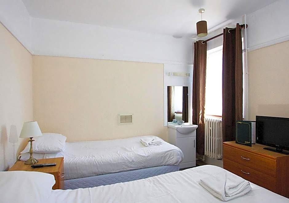Photo 1 of 2 of Twin Room with Shared Bathroom
