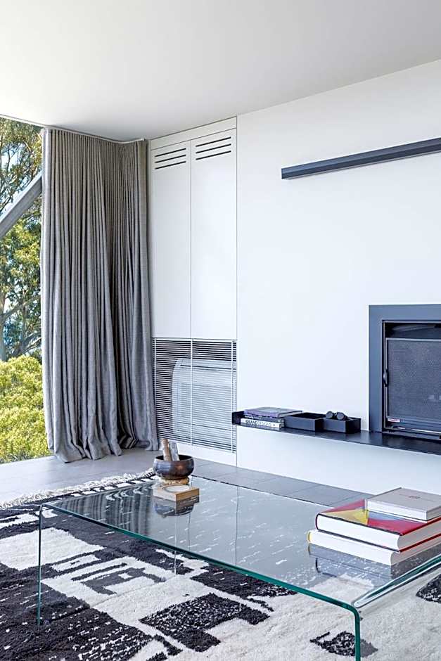 Architectural glass house with ocean views