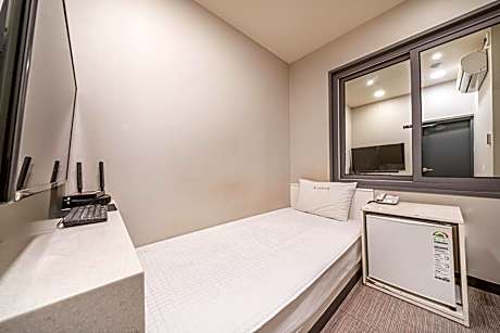 Single Bed in Dormitory Room