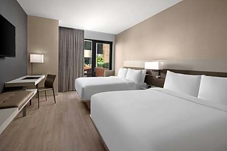 Queen Room with Two Queen Beds, Courtyard View and Adapted Tub - Mobility and Hearing Accessible