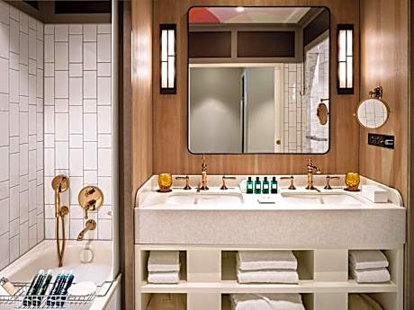 Junior King Suite with One King Bed/One Sofa Bed and Living Room - Courtyard or Rue Scribe View