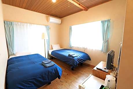 Log house twin room with shower and toilet