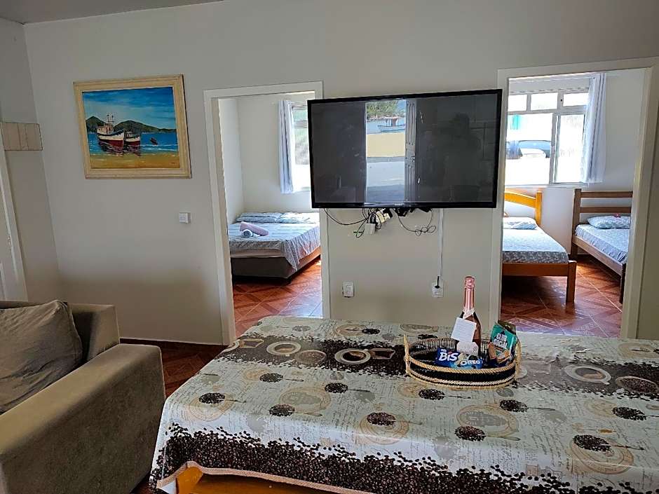 Casa pé na areia com vista especial do pôr do sol.