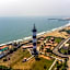 Treebo Grace Inn, 3 Min Walk From Promenade Beach