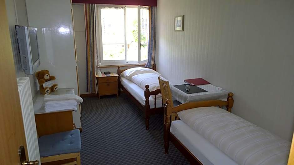 Photo 1 of 8 of Twin Room with Shared Bathroom