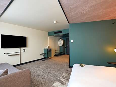 Superior Room with 1 queen bed, sofa and wheelchair access