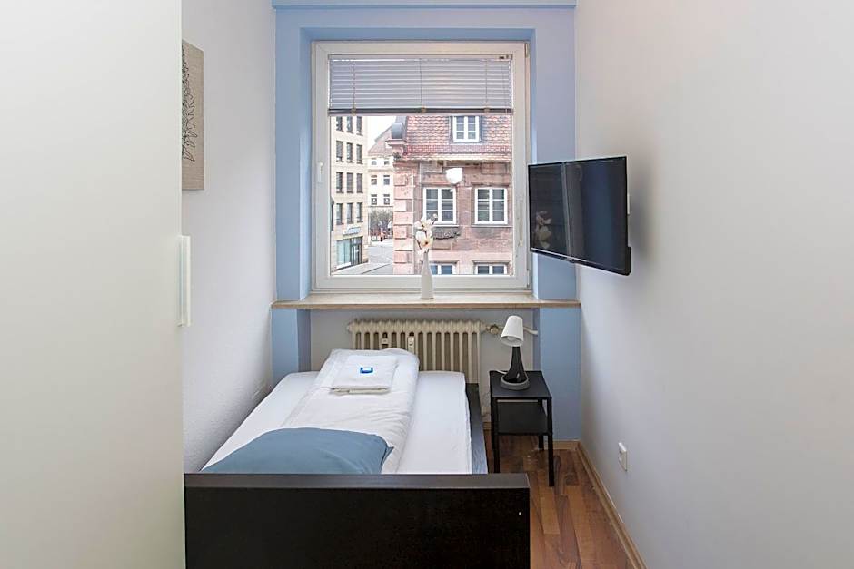Zentral gelegene Zimmer mit Gemeinschaftsbad und Küche