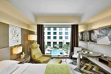 King Room with Pool View and INR 500 F&B credit, 1+1 Happy Hours (selected brands) and 15% discount on Spa