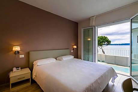 Superior Triple Room with Balcony and Lake View