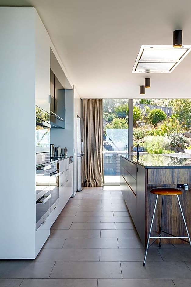 Architectural glass house with ocean views