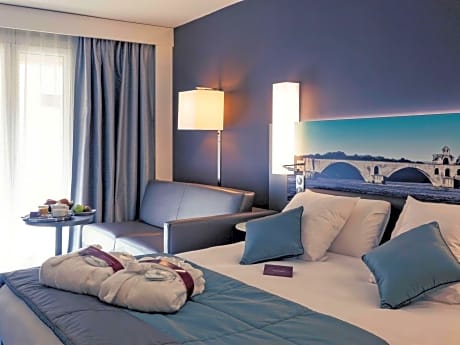 Privilege Room with a double bed and a sofa