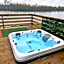 Award winning Serenity Lodge with outstanding lakeside views from the hot tub , at Tallington Lakes Leisure Park, Stamford
