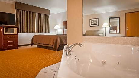 Suite-1 King Bed, Non-Smoking, Junior Suite, Sofabed, Lounge Area, Corner Whirlpool, Microwave And R