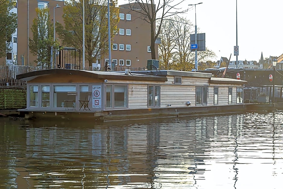 HouseBoat next to AMSTEL