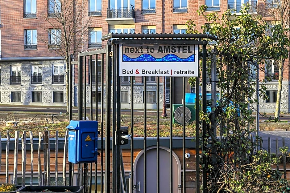 HouseBoat next to AMSTEL