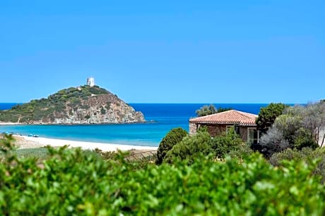 Baia Chia Laguna Resort, Curio Collection by Hilton