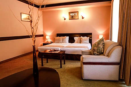 Suite with One King and Two Single Beds with Balcony and Spa Bath - Non-Smoking