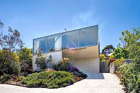 Architectural glass house with ocean views
