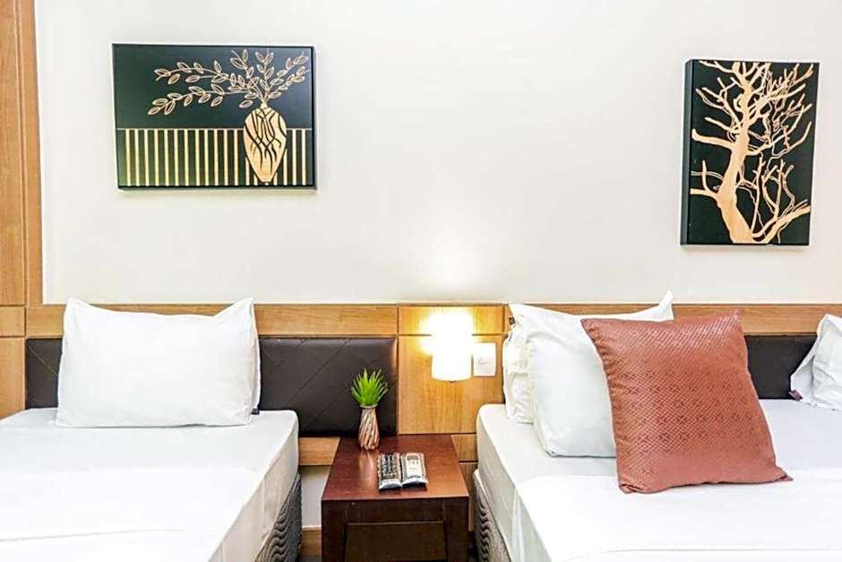 Foto 1 de 5 de Premium Triple - 1 King Bed and 1 Single Bed