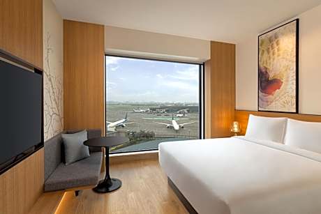 Deluxe Queen Room with Garden View with 50% discount on Buffet , 10% off on Airport Transfers , Laundry and Happy Hours on beverages enjoy 1+1 offer on select beverages