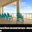 ON THE BEACH! COUPLES GETAWAY,HONEYMOON SWEET, Perfectly Cozy Beach Front Condo, full kitchen, pool, free parking,CHECK-IN AT DOOR