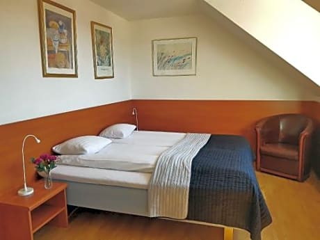 Standard Double Room with twin beds and a shared balcony