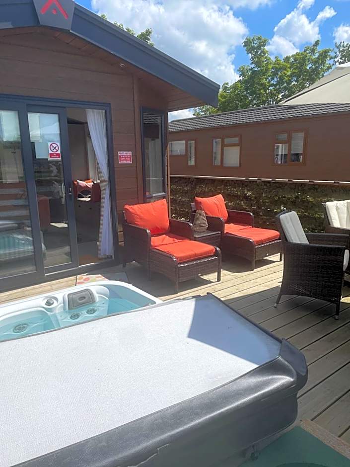 Award winning Serenity Lodge with outstanding lakeside views from the hot tub , at Tallington Lakes Leisure Park, Stamford