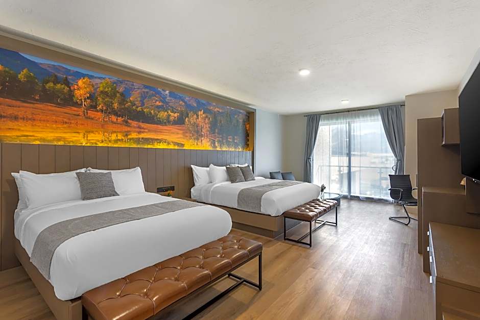 Photo 1 of 7 of 1 King Bed, 1 Queen Bed, Suite, Non-Smoking