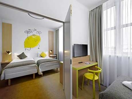 family room with one double and one single bed