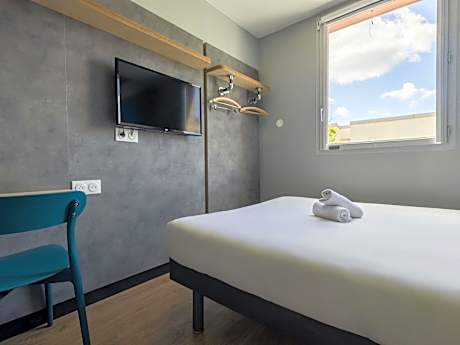 Room with One Queen Bed and One Bunk Bed