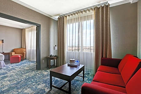 One-Bedroom King Suite with Airport View, City View and Roll-In Shower - Mobility Access