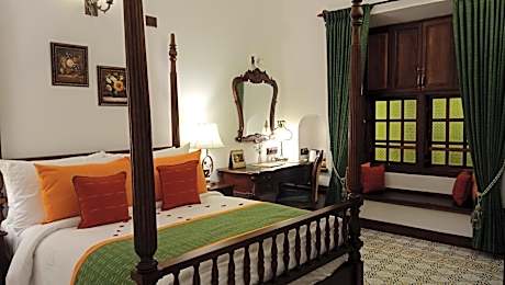 Classic Double Room with 10% discount on food, 20% discount on Ayurmana, and one and a half-hour guided heritage walk from 7 AM to 8:30 AM