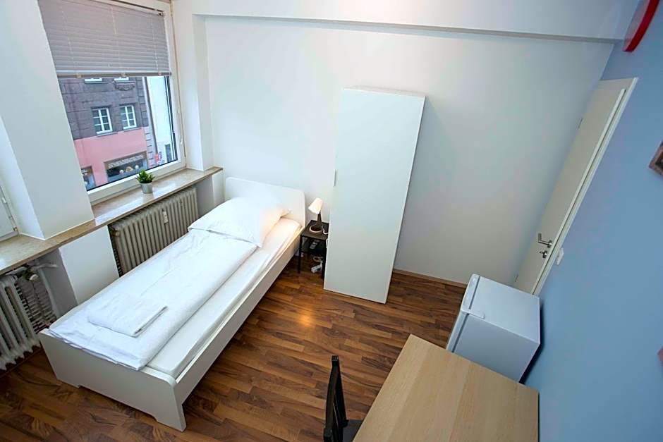 Zentral gelegene Zimmer mit Gemeinschaftsbad und Küche
