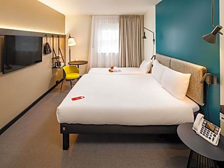 family room with one double and one single bed