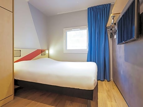 Room with One Queen Bed and an armoire bed