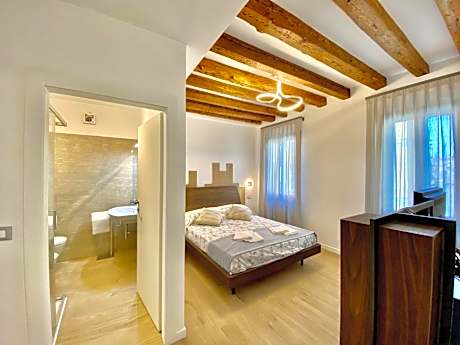 One-Bedroom Apartment with Balcony and Canal View