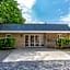 Designed home with bedstead, surrounded by forest