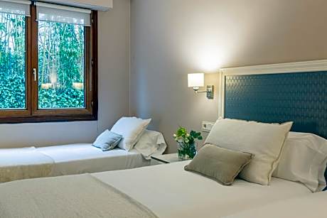 Habitación Triple Parking Gratuito