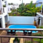 Villa Alizée - Boutique Hôtel Expérience - Idéal Couples & Pros - Piscine - Restaurant - Rooftop bar - Parking privé - 10min Port-Louis - Ambiance Tropical chic & authentique