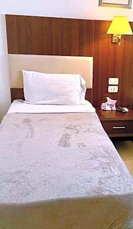 Single Bed in Dormitory Room