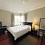 A cozy bedroom with a private washroom close to YVR Richmond