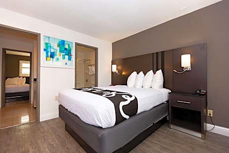 Room with One Queen and Two Double Beds