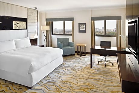 Superior guest room with king bed and city view
