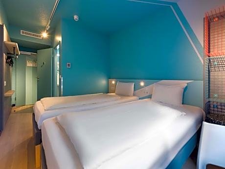 Small twin room with private bathroom and toilet