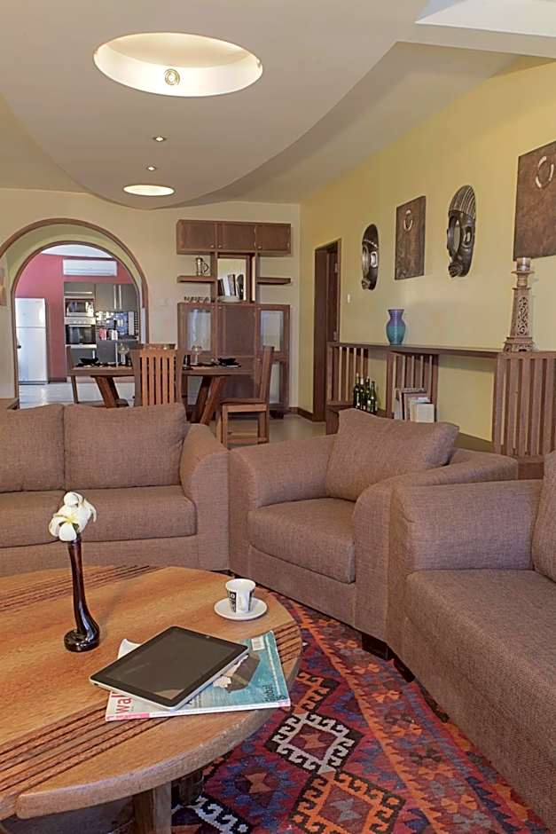 Cowrie Shell Beach Apartments Official