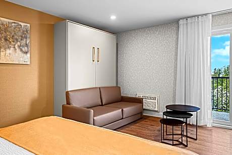 Room with One King Bed and One Queen Murphy Bed, Balcony - Non-Smoking