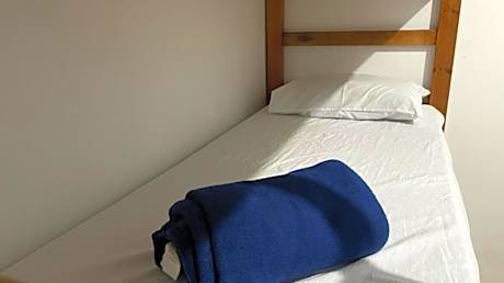 Single Bed in Dormitory Room